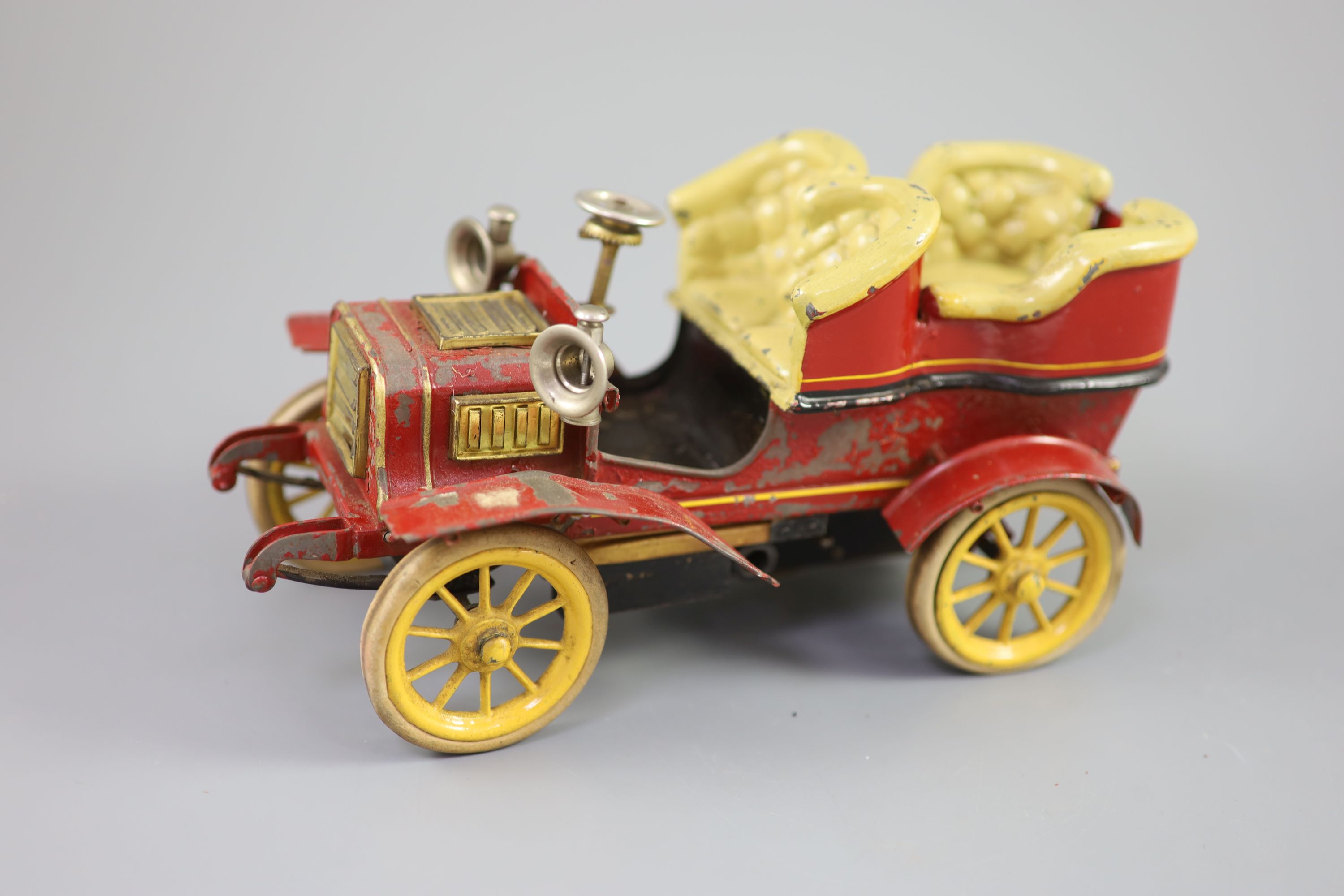 A Bing clockwork tinplate car, c.1906, length 9.5in. width 5in., with original card box and winding key